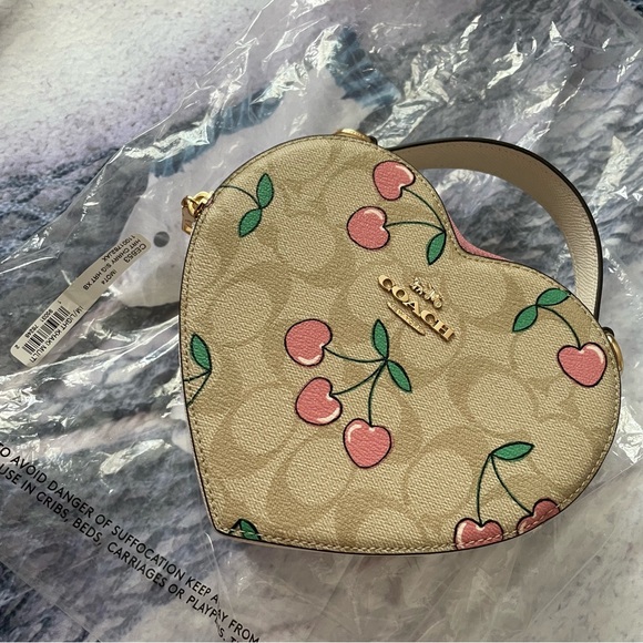 Coach Handbags - coach cherry heart crossbody 🩷PRICE FIRM ON THIS ONE